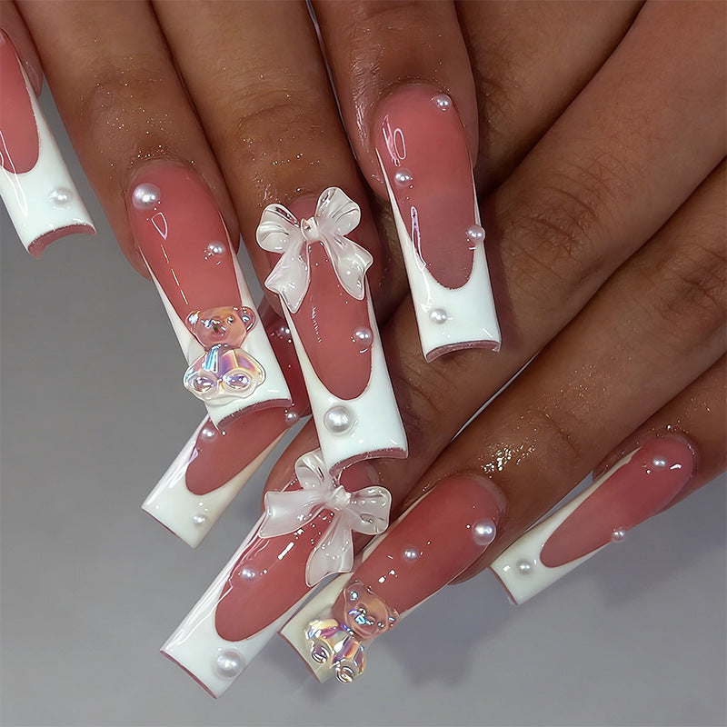 Elegant artificial nails with delicate bows and pearls Bowlift