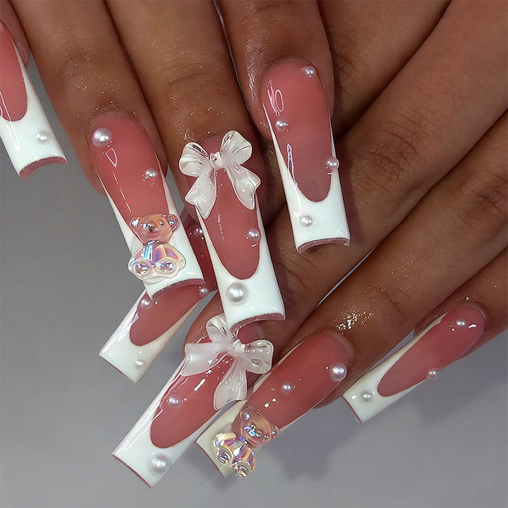 Elegant artificial nails with delicate bows and pearls Bowlift
