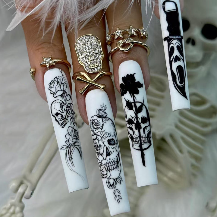 Nail set with spooky skull design and floral motifs Bowlift
