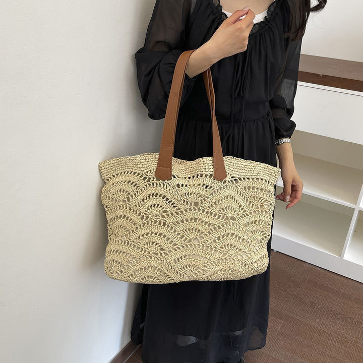 Handbag made of high-quality woven natural material with elegant leather handles Bowlift
