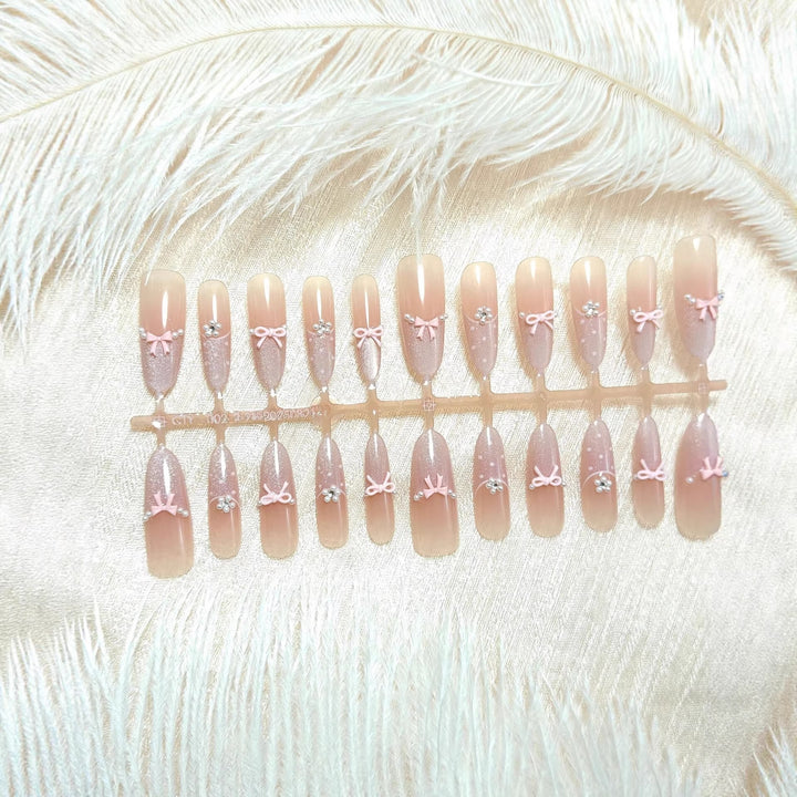 Artificial nails with elegant glitter and bow design Bowlift