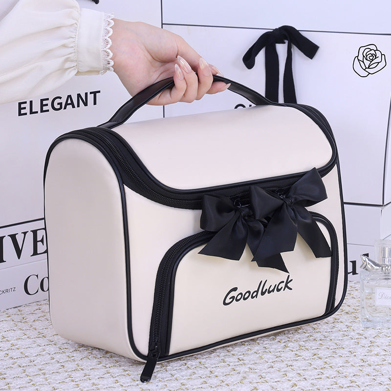 Cosmetic and toiletry bag with elegant bow accent Bowlift