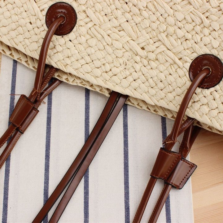 Beach bag made of high-quality braided straw with stylish leather handles Bowlift