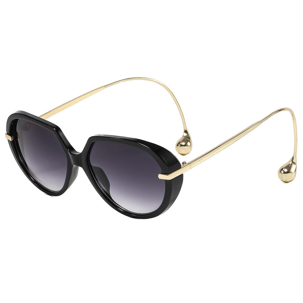 Women's Cat-Eye Sunglasses with Golden Accents and Stylish Frame Bowlift