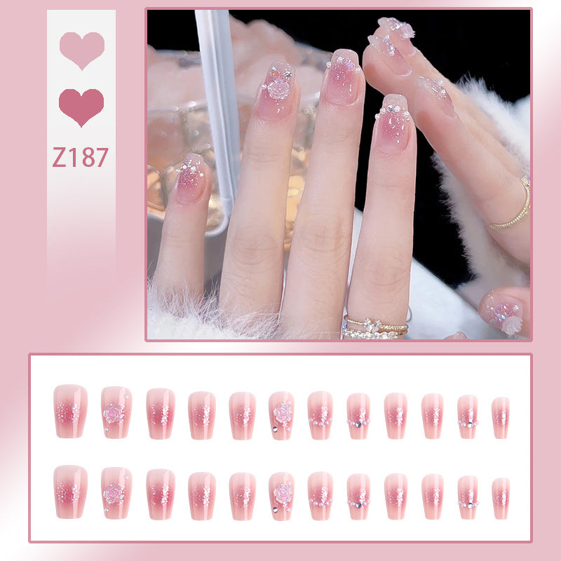Artificial nail set with sparkling glitter and pearl decorations Bowlift