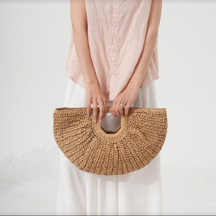 Designer Bast handbag with unique cut Bowlift