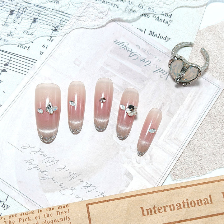 Glamorous artificial nails with glitter decorations Bowlift