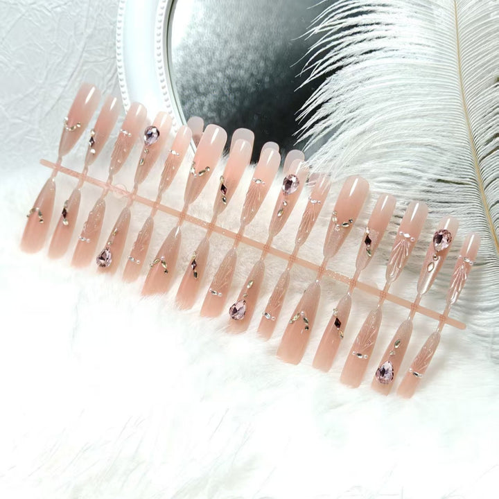 Artificial nails with glamorous crystal embellishments Bowlift