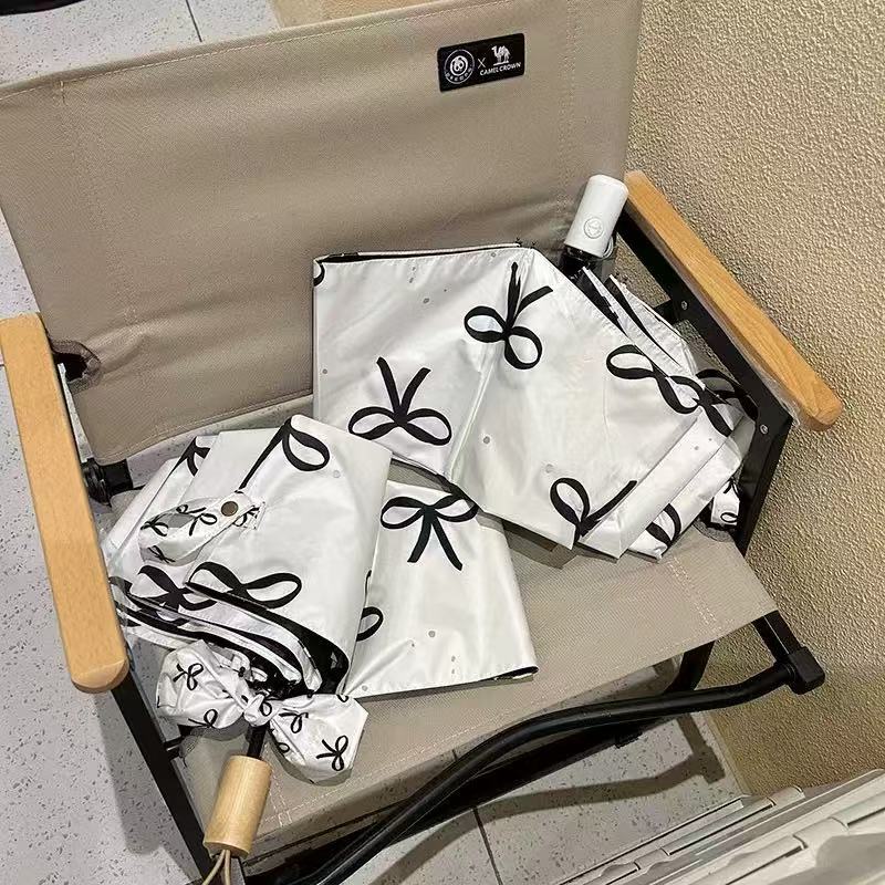Women's foldable umbrella with elegant bow design Bowlift