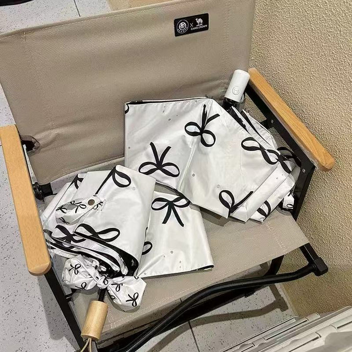 Women's foldable umbrella with elegant bow design Bowlift