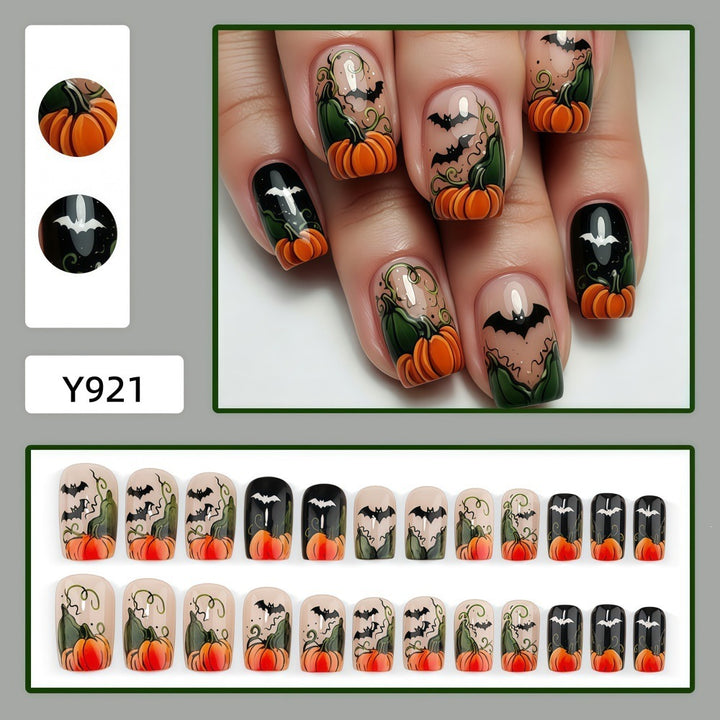 Artificial nails in Halloween design with pumpkins and ghosts Bowlift