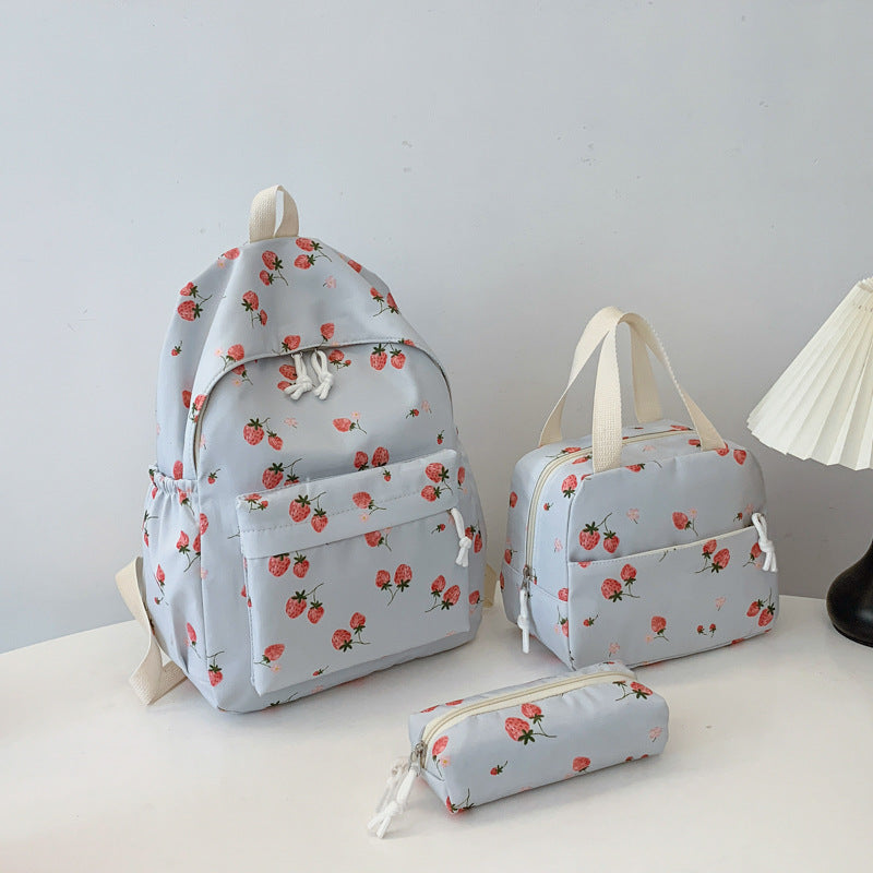 Backpack set with cheerful strawberry pattern and practical compartments Bowlift