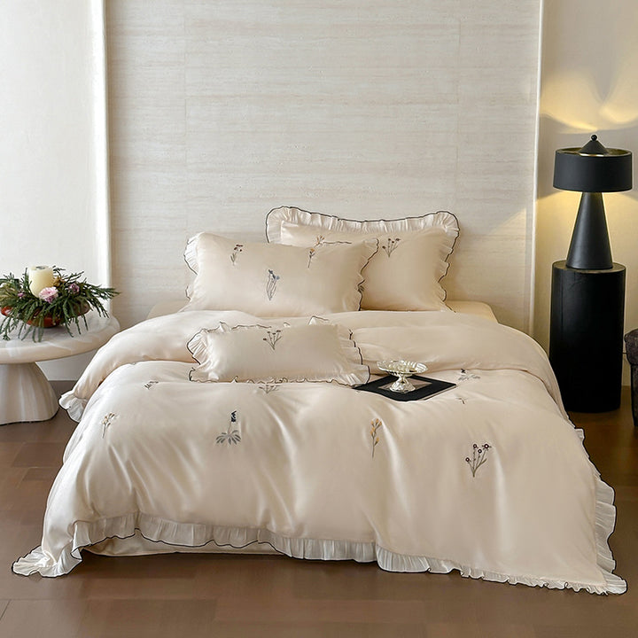 Satin bedding set with pleated frill and delicate embroidery