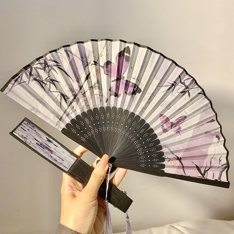 Elegant fan with elaborate butterfly motif Bowlift