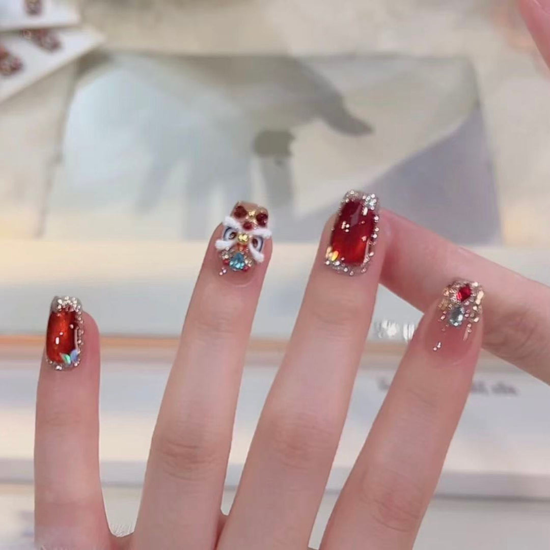 Artificial nails with glitter and gemstone applications Bowlift