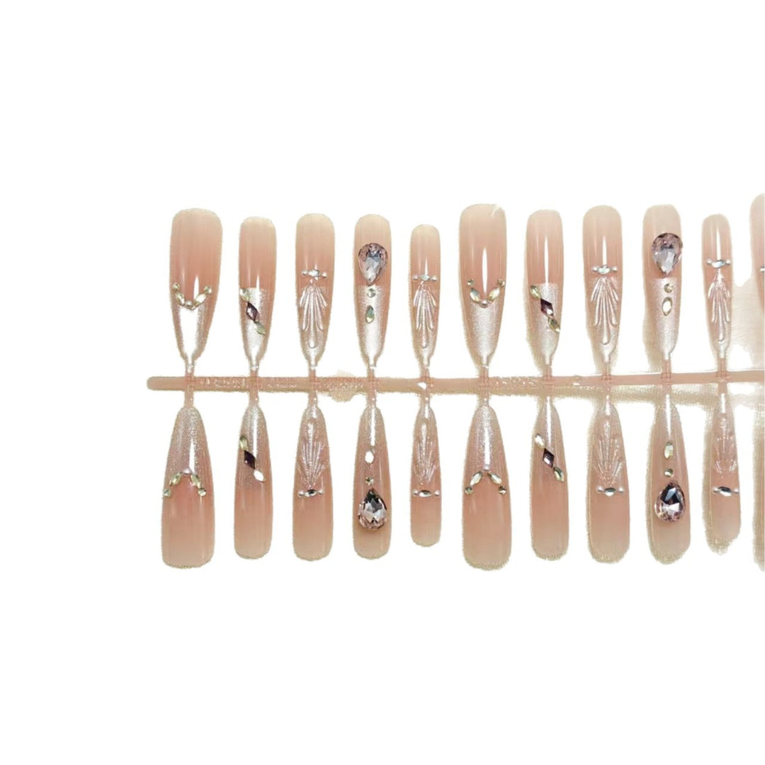 Artificial nails with glamorous crystal embellishments Bowlift