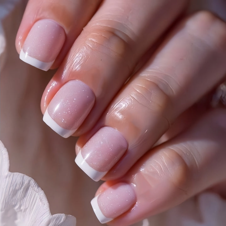 Artificial nails in elegant French tip design Bowlift