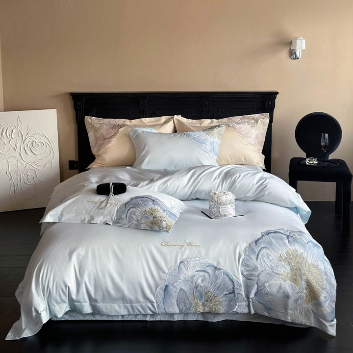 Satin bedding set with floral relief embroidery and velvety shine Bowlift