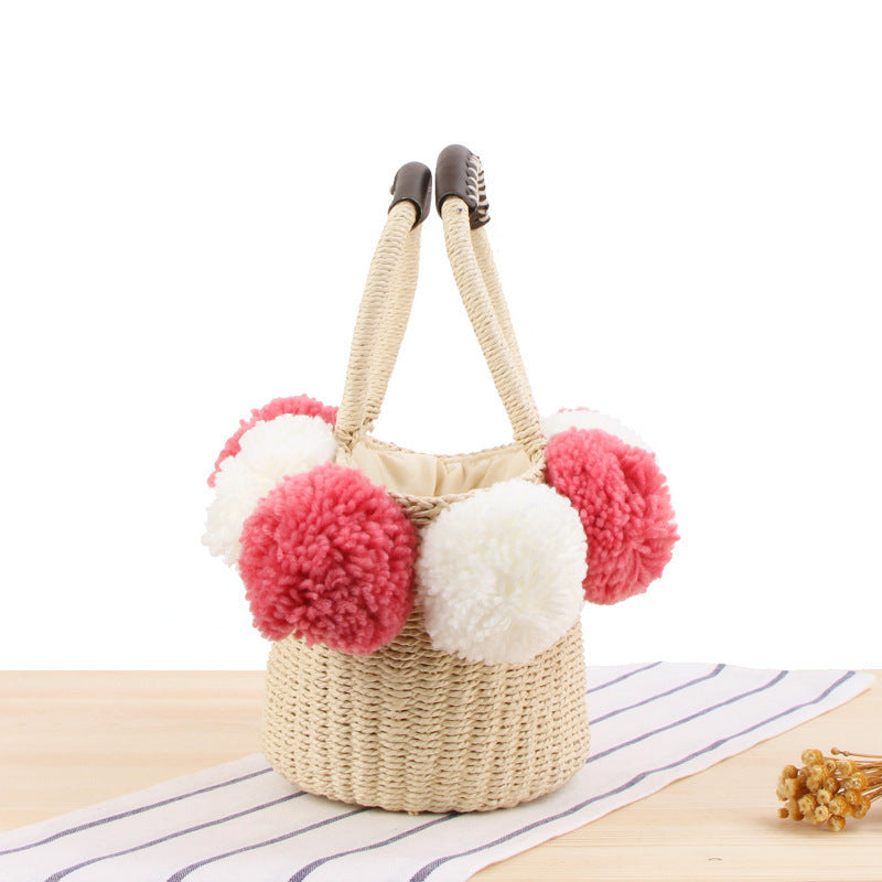 Basket bag with decorative pompons Bowlift