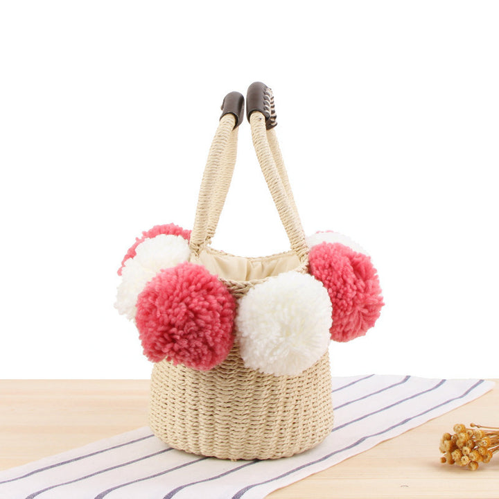 Basket bag with decorative pompons Bowlift