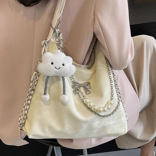 Fashionable handbag with unique pendant and chain accents Bowlift