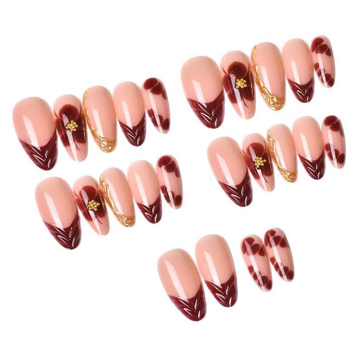 Exclusive artificial nails with floral designs and gold embellishments Bowlift