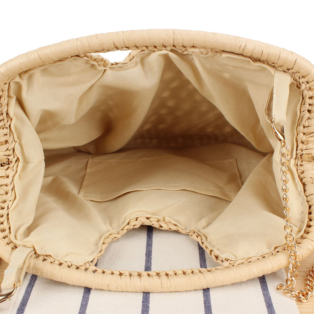 Handbag made of naturally untreated woven material with elegant chain embellishment Bowlift