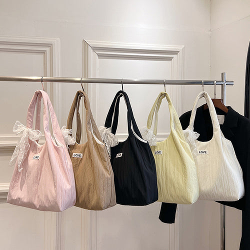 Leisure bag with structured design and playful scarf Bowlift