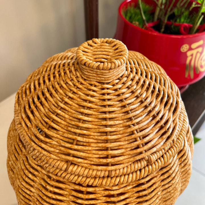 Women artfully woven storage pot Bowlift