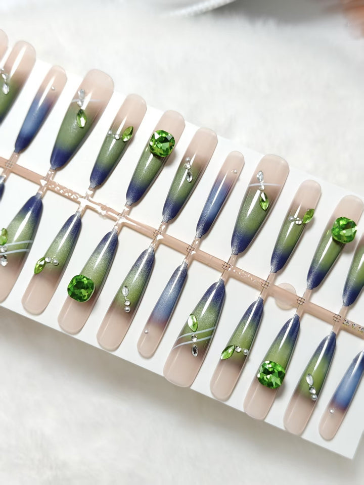 Artificial nails with elegant gradient color and glitter accents Bowlift