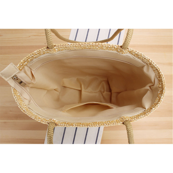 Shoulder bag made of braided natural material with long shoulder straps Bowlift