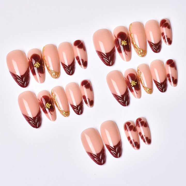 Exclusive artificial nails with floral designs and gold embellishments Bowlift