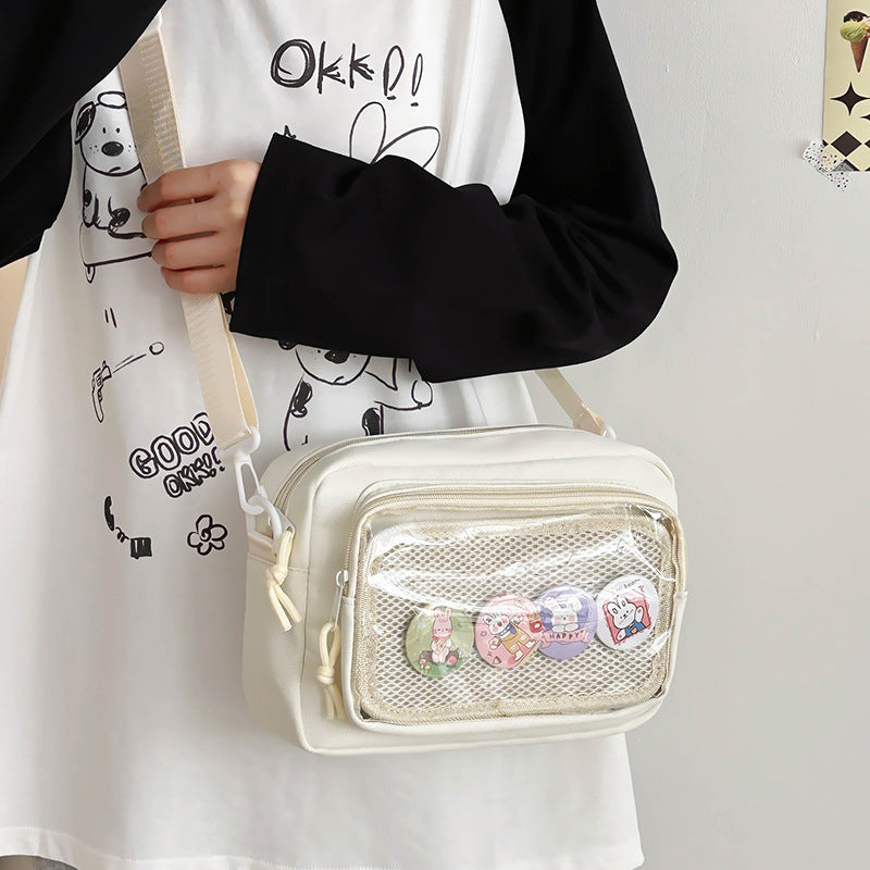 Shoulder bag with transparent viewing pocket and playful graphic design Bowlift