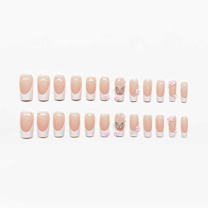 Artificial nail set with playful 3D flowers and glitter accents Bowlift