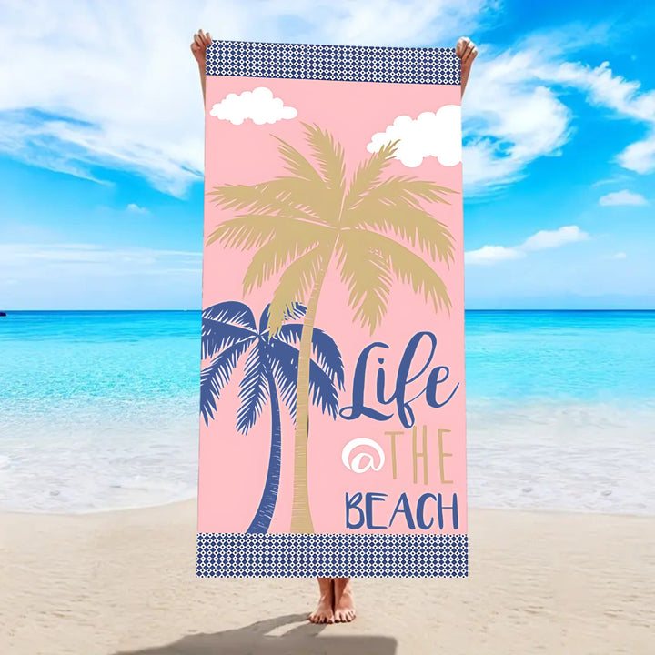 Beach towel with tropical palm leaf pattern Bowlift