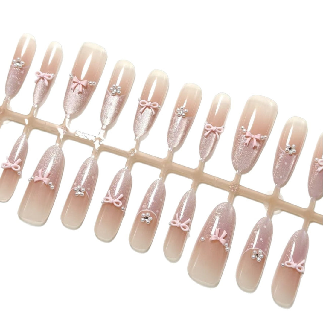 Artificial nails with elegant glitter and bow design Bowlift