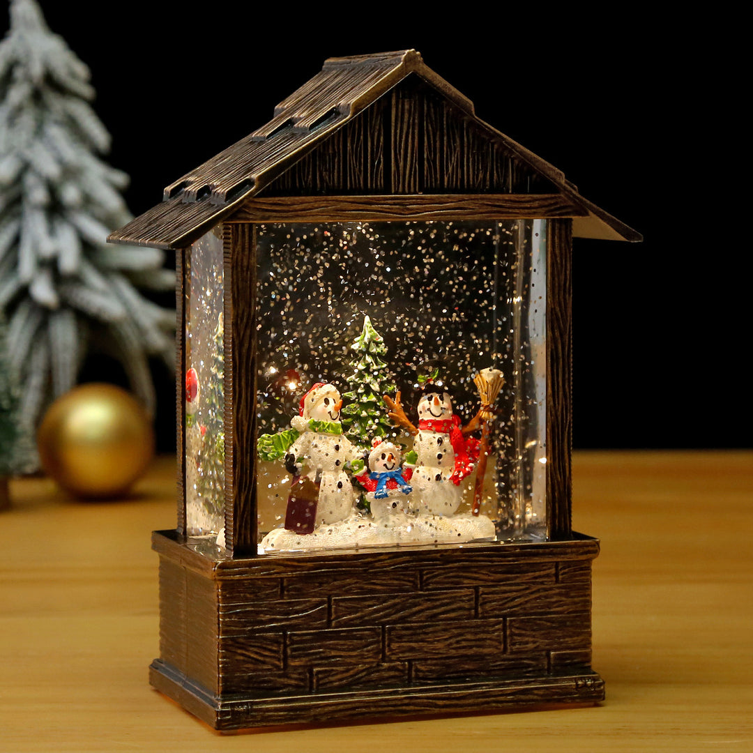 Nostalgic snow globe decoration with Santa Claus and children Bowlift