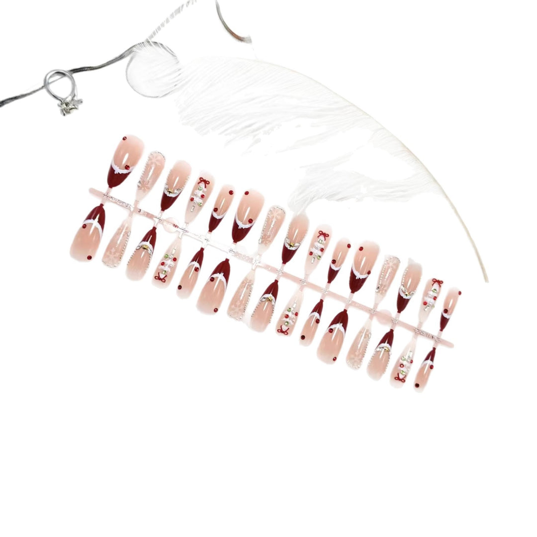 Artificial nails with festive designs and glitter accents Bowlift