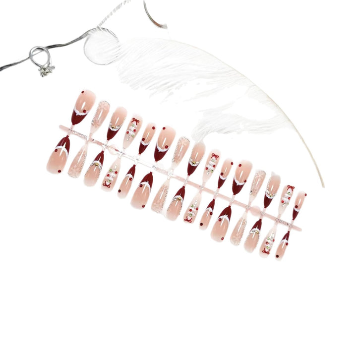 Artificial nails with festive designs and glitter accents Bowlift