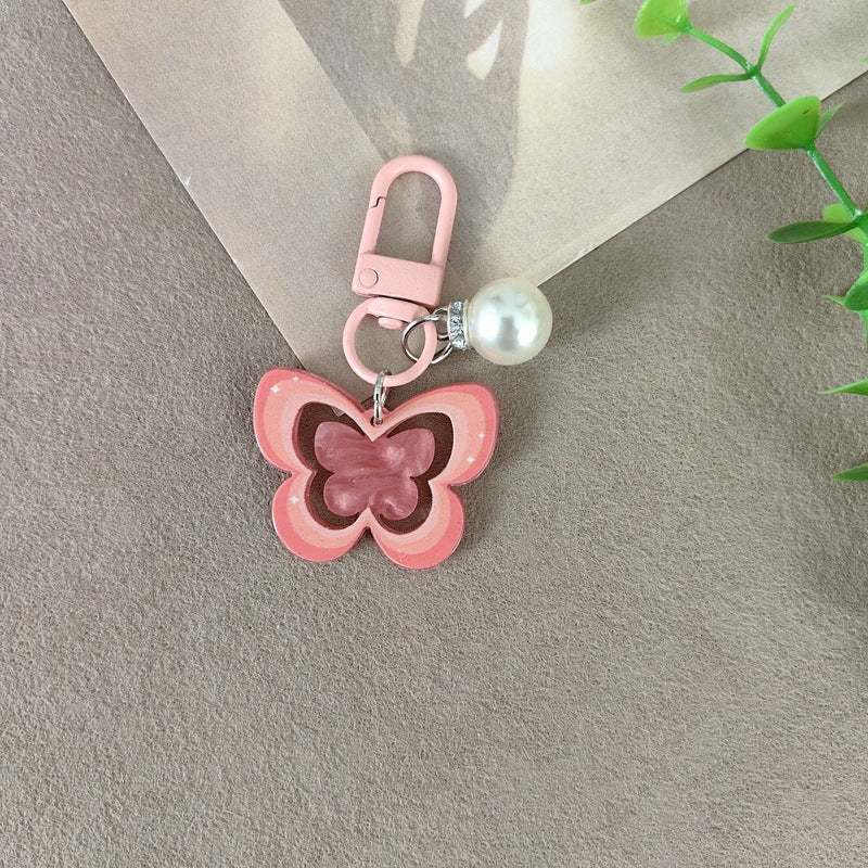 Keychain with butterfly and pearl accent Bowlift