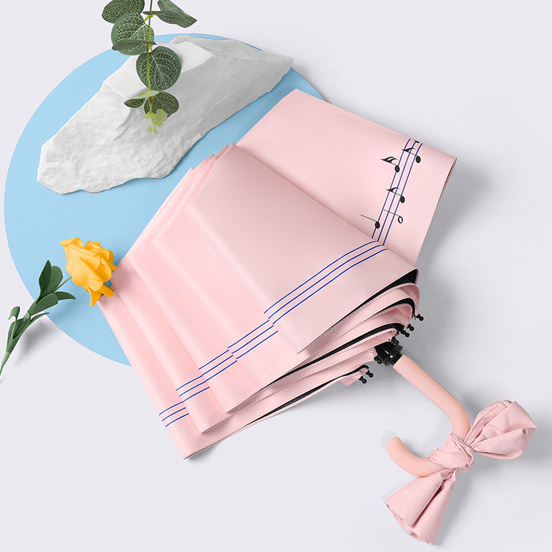 Ladies elegant folding umbrella with ergonomic wooden handle and protective carrying case Bowlift