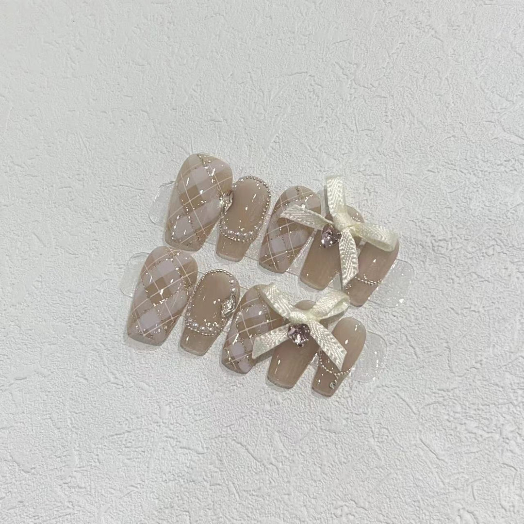 Elegant Press-On Nail Art Set with Ribbons and Gemstone Accents Bowlift
