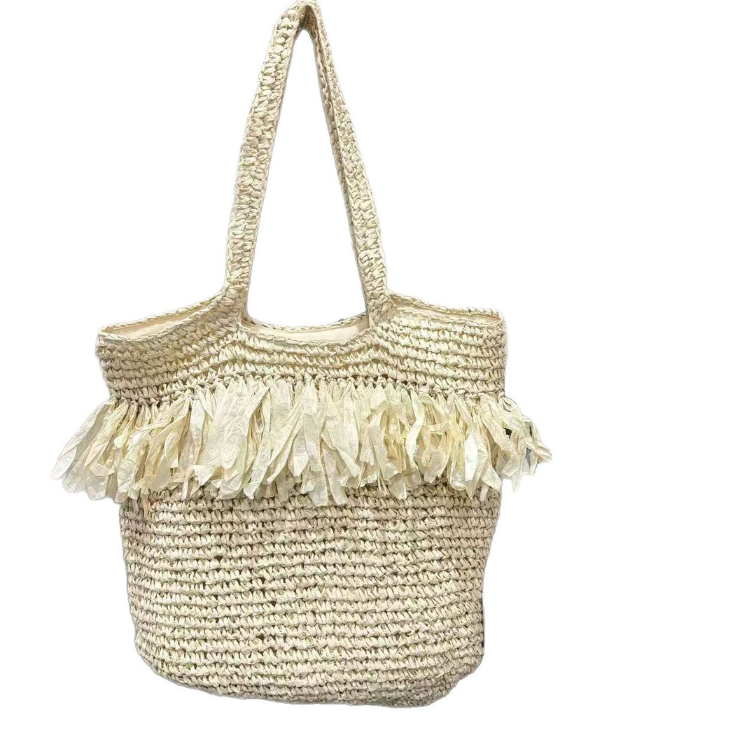 Elegant straw bag with fringed accents Bowlift