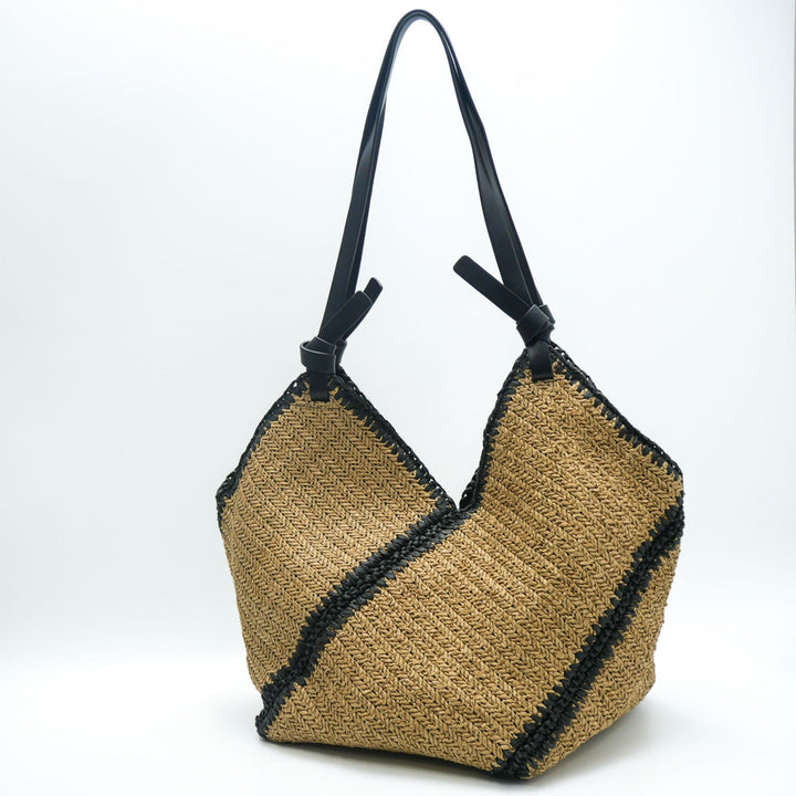 Fashionable beach bag made of woven natural material with leather handles Bowlift