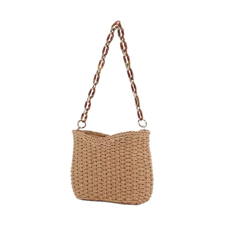 Handcrafted straw bag with golden chain details Bowlift