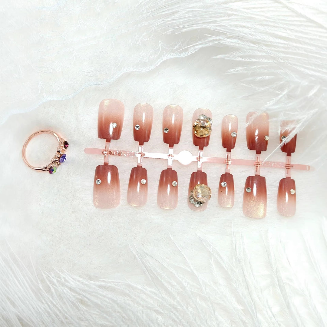 Artificials nails in elegant ombre style with rhinestone embellished applications Bowlift