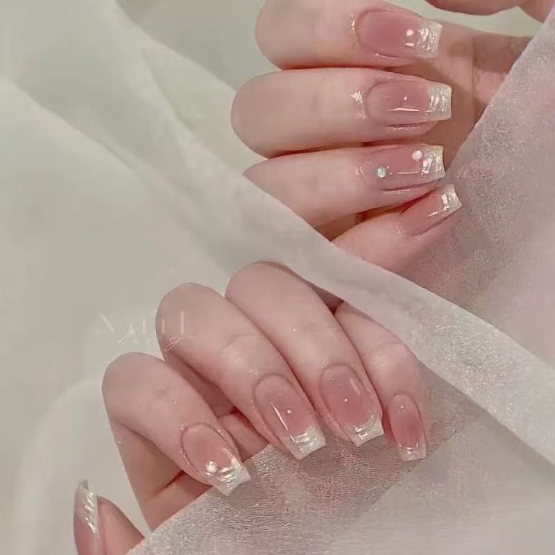 Glamorous artificial nails with rhinestone details Bowlift