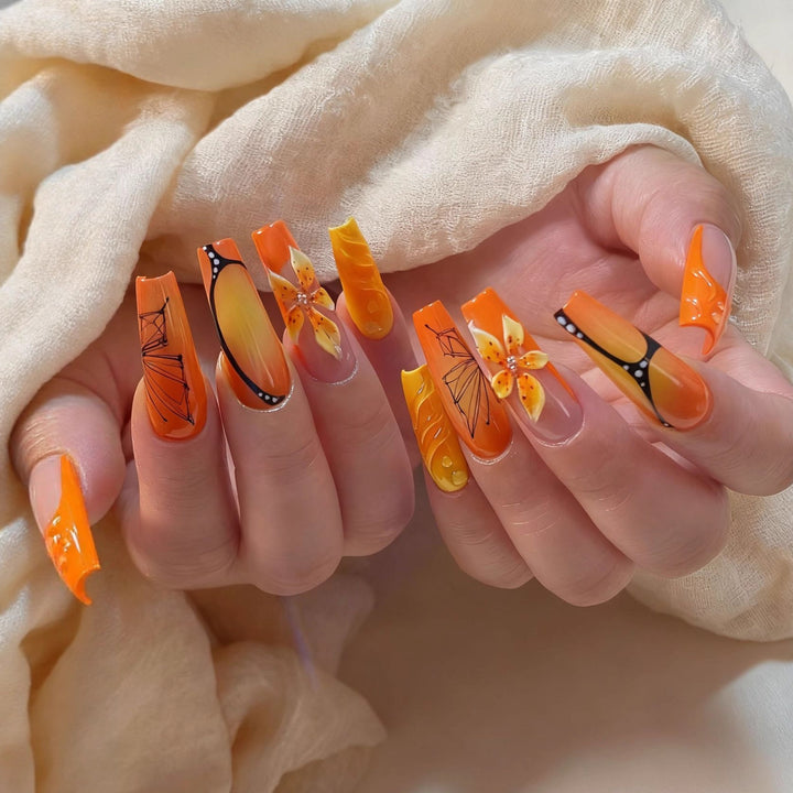 Artificial nails with creative flower designs and sparkling accents Bowlift