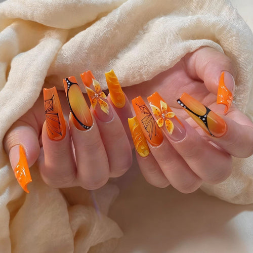 Artificial nails with creative flower designs and sparkling accents Bowlift