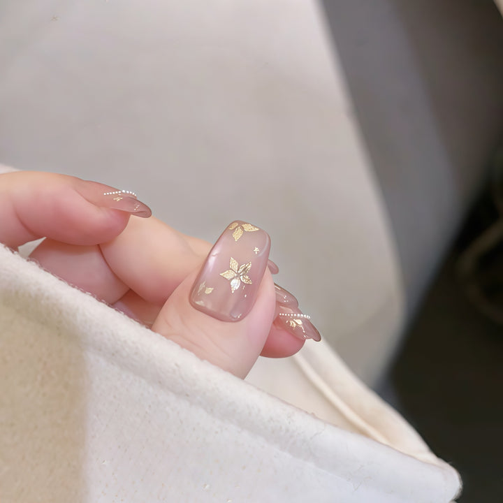 Artificial nails with elegant gold designs Bowlift